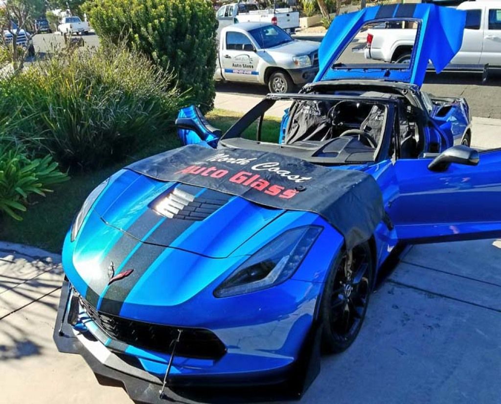 Blue Corvette during a windshield job
